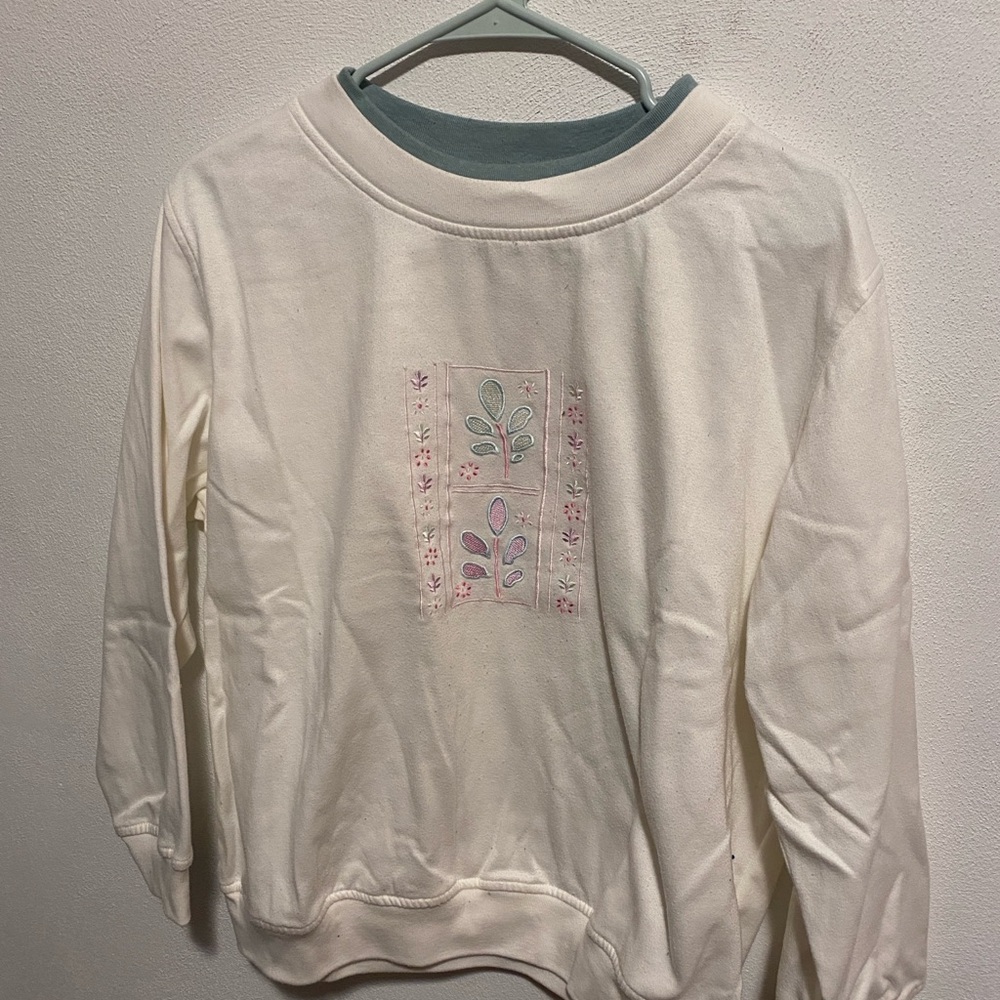 Elegant Cream Sweater with Floral Design